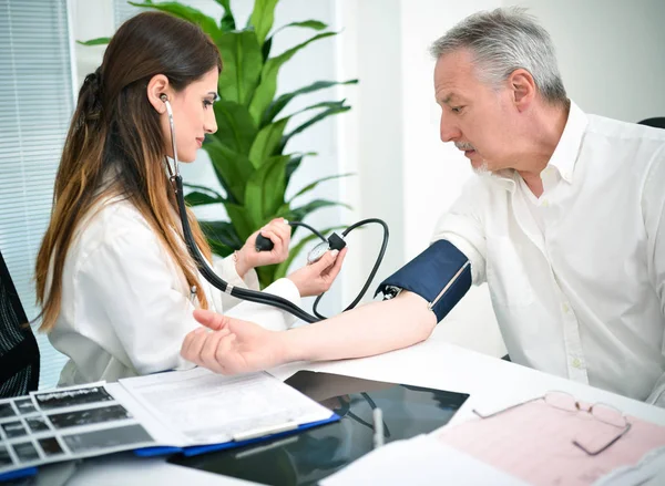Depositphotos 139814820 Stock Photo Doctor Cheking Patients Blood Pressure
