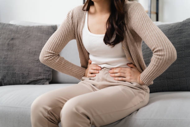 The Woman With A Stomachache Is