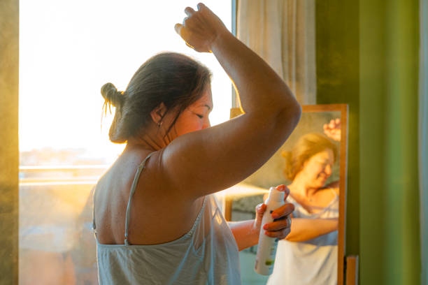 Woman Applying Deodorant On Unde