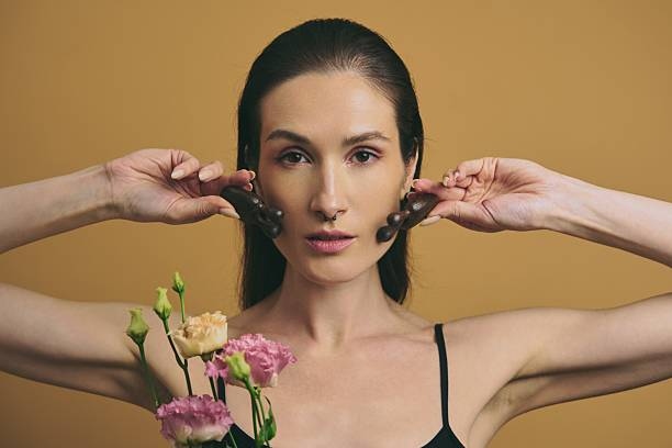 Woman Holding Flowers And Chocol