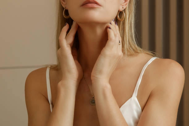 Caucasian Woman Touching Her Thr (2)