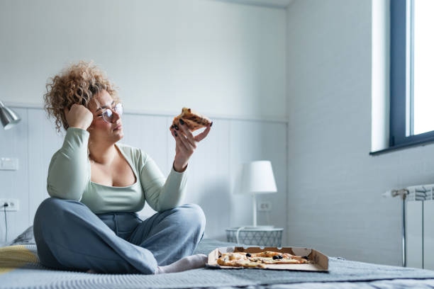 Overweight Woman Thoughtfully Ea
