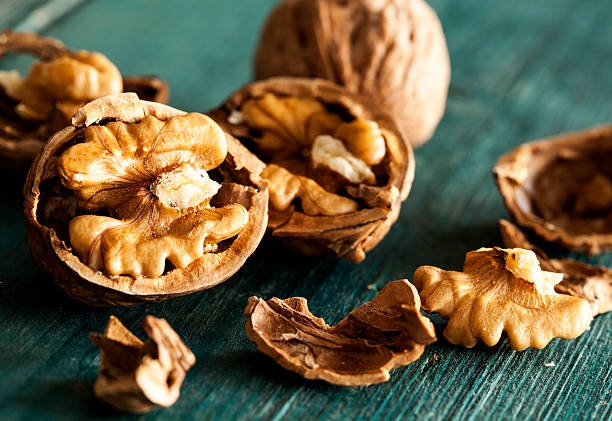 Walnuts On Wooden Table