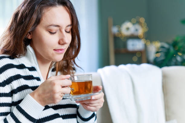 Young Woman Drinking Her Winter