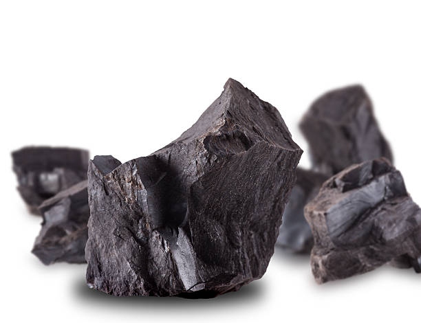 Coal Lumps Spilled On White