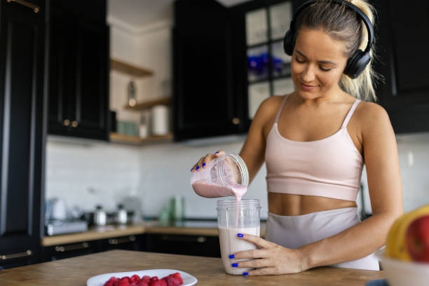 Sportswoman Preparing Smoothie I